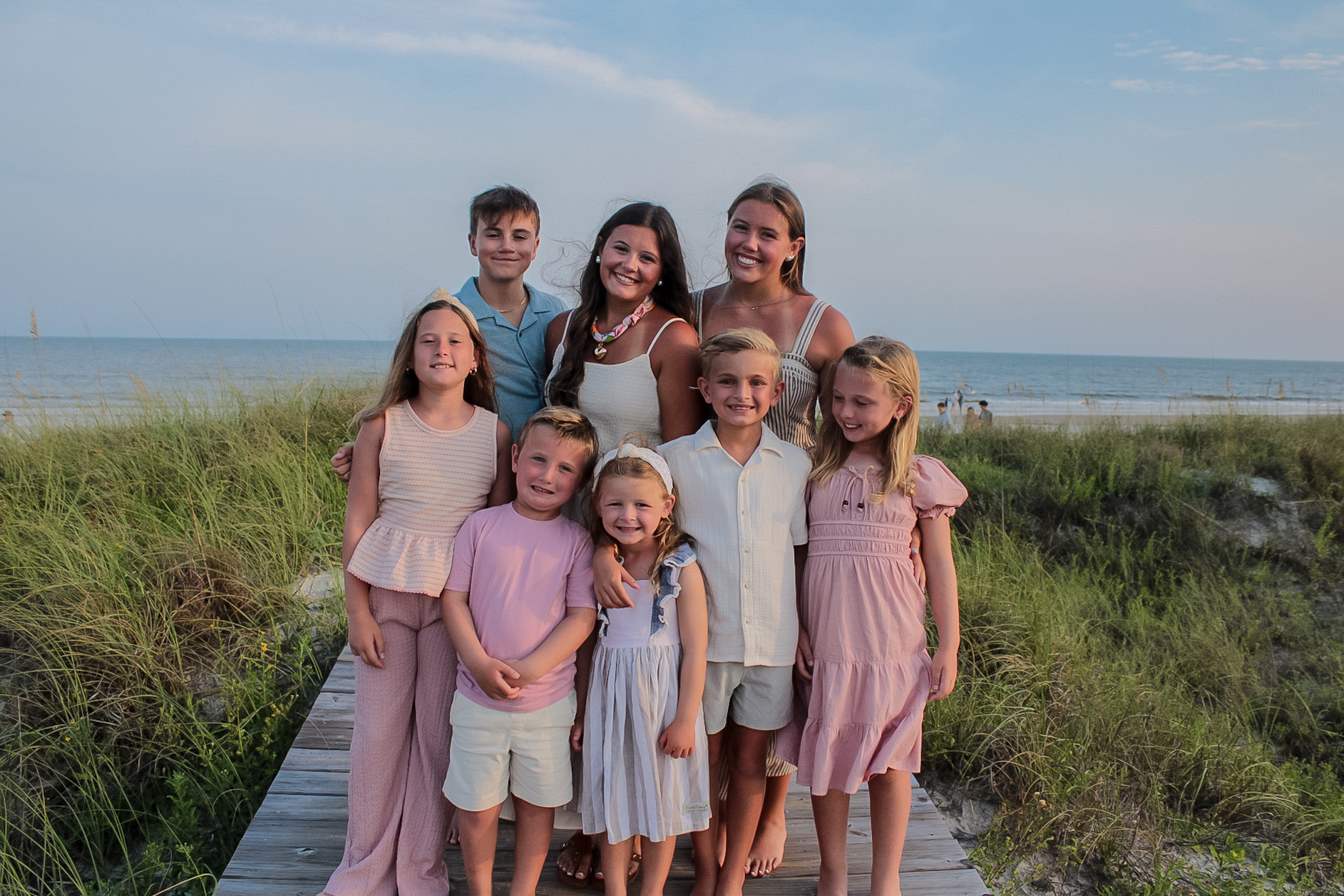 Extended family children gathered for a beach portrait on the Gulf Coast